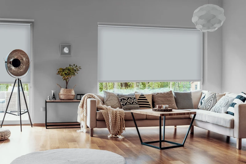 View outside to the green woods through large glass windows in a