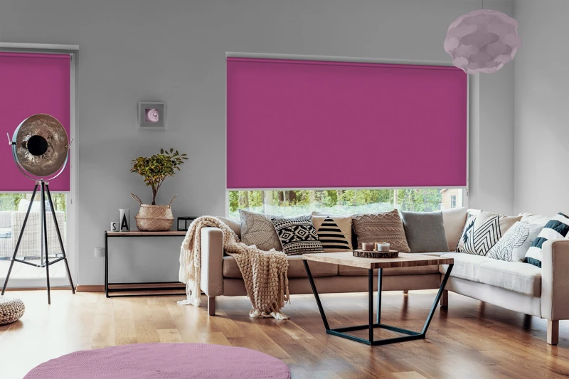 View outside to the green woods through large glass windows in a