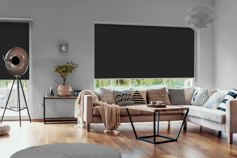 View outside to the green woods through large glass windows in a