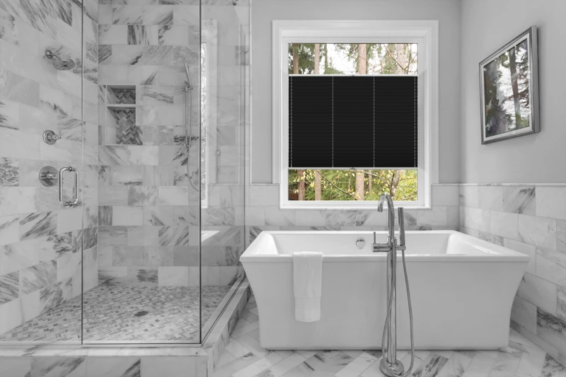 Bathroom with bathtub and shower in new luxury home with all gla