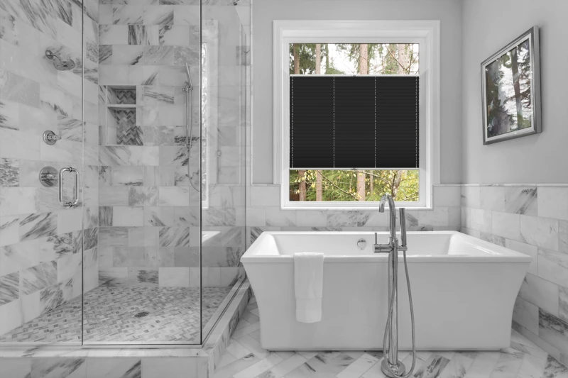 Bathroom with bathtub and shower in new luxury home with all gla