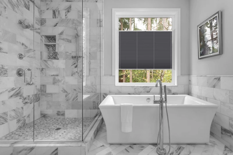 Bathroom with bathtub and shower in new luxury home with all gla