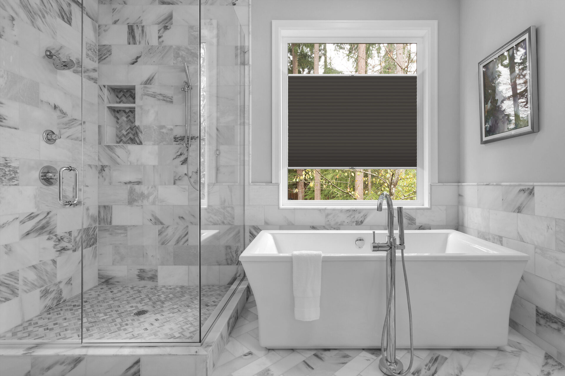 Bathroom with bathtub and shower in new luxury home with all gla